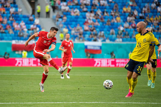 Robert Lewandowski of Poland and Marcus Danielson of Sweden
