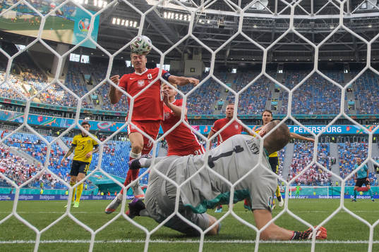 Robert Lewandowski of Poland with a header towards