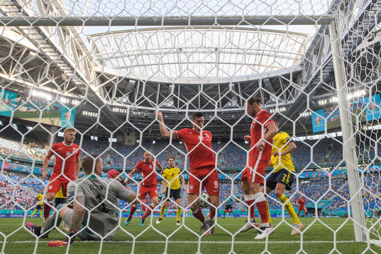 Robert Lewandowski of Poland attacks in front of goalkeeper