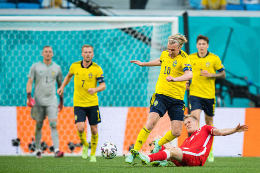 Emil Forsberg of Sweden and Karol Swiderski of Poland
