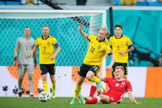 Emil Forsberg of Sweden and Karol Swiderski of Poland