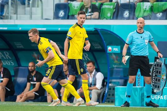 Emil Krafth change with Mikael Lustig of Sweden