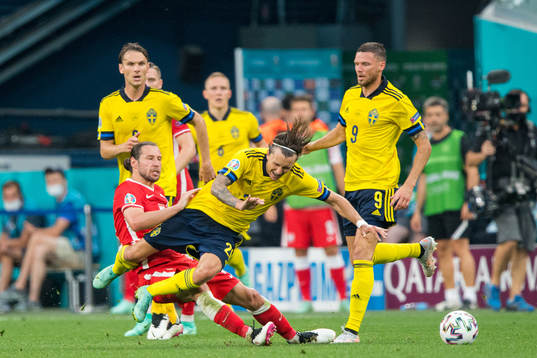 Grzegorz Krychowiak of Poland and Kristoffer Olsson of