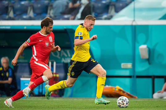 Bartosz Bereszynski of Poland and Dejan Kulusevski of Sweden