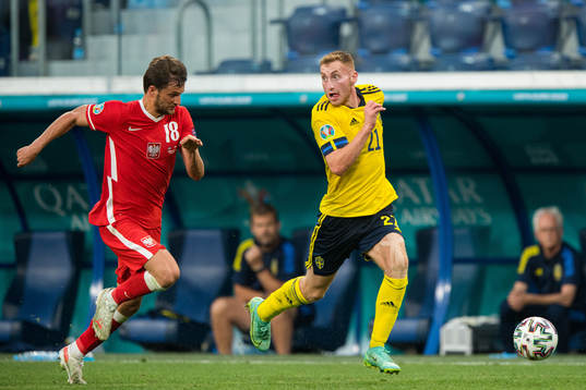 Bartosz Bereszynski of Poland and Dejan Kulusevski of Sweden