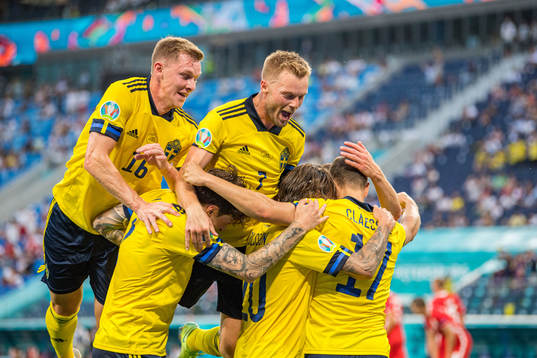 Emil Krafth and Sebastian Larsson celebrate with Viktor