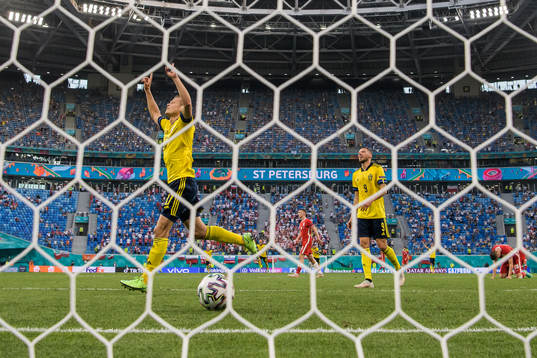 Viktor Claesson and Marcus Berg of Sweden celebrate the 3-2