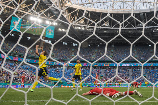 Viktor Claesson and Marcus Berg of Sweden celebrate the 3-2