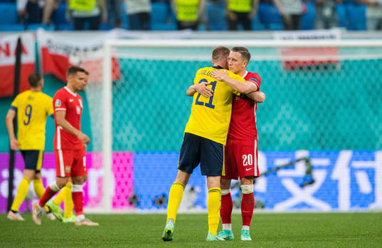 Dejan Kulusevski of Sweden and Piotr Zielinski of Poland