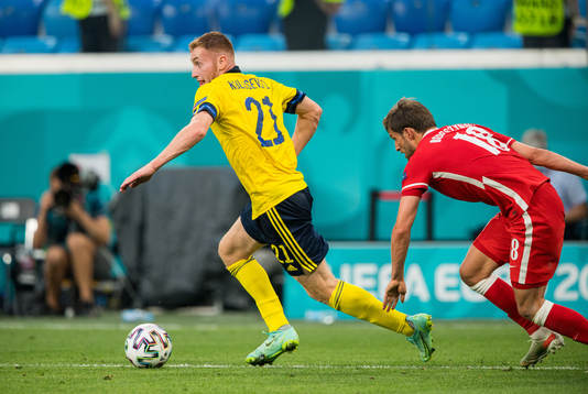 Dejan Kulusevski of Sweden and Bartosz Bereszynski of Poland
