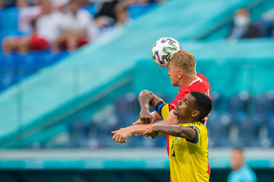 Kamil Glik of Poland and Alexander Isak of Sweden