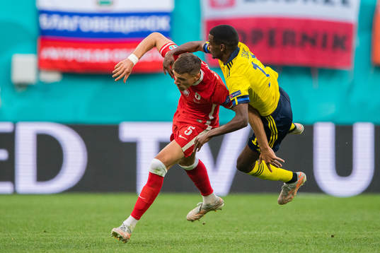 Jan Bednarek of Poland and Alexander Isak of Sweden