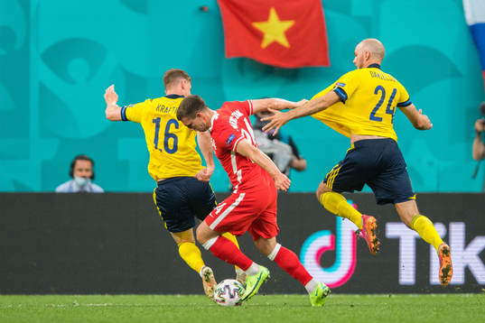 Jakub Swierczok of Poland against Emil Krafth and Marcus
