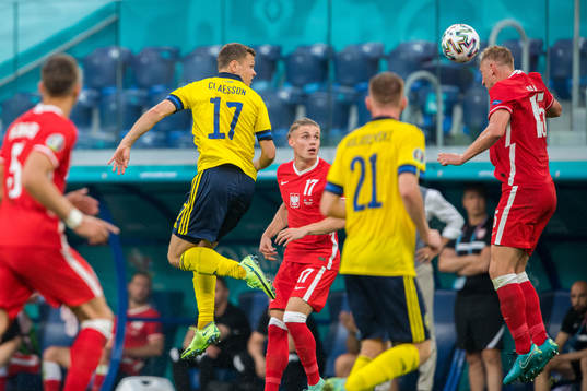 Viktor Claesson of Sweden and Kamil Glik of Poland