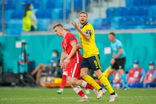 Kacper Kozlowski of Poland and Marcus Berg of Sweden
