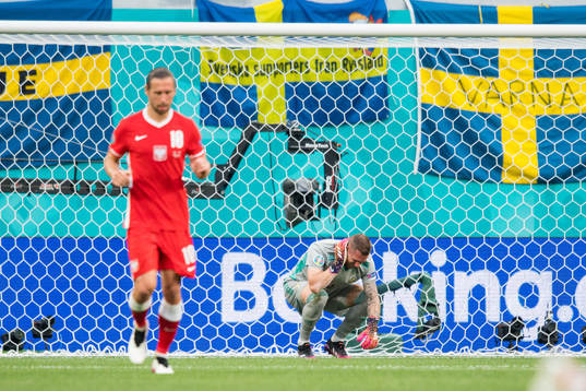 Goalkeeper Robin Olsen of Sweden in pain
