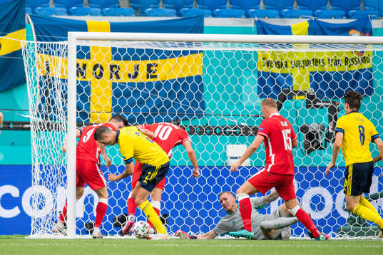 Mikael Lustig and goalkeeper Robin Olsen of Sweden against