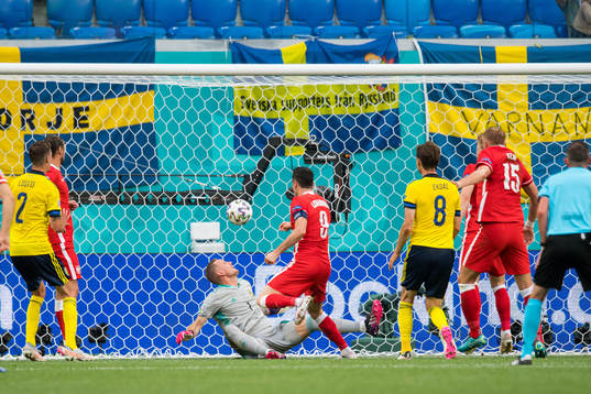 Robert Lewandowski of Poland against goalkeeper Robin Olsen