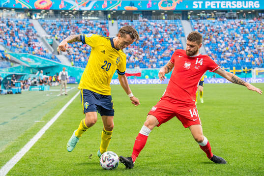 Kristoffer Olsson of Sweden and Mateusz Klich of Poland