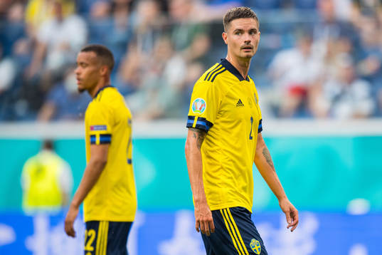 Mikael Lustig and Robin Quaison of Sweden