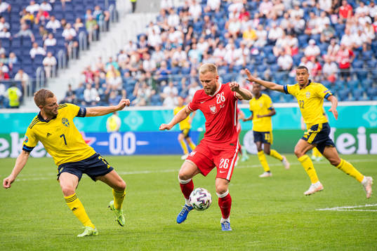 Sebastian Larsson of Sweden and Tymoteusz Puchacz of Poland