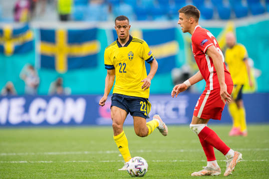 Robin Quaison of Sweden and Jan Bednarek of Poland