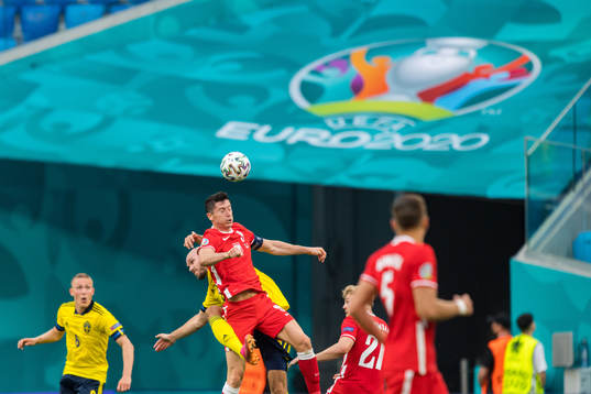 Robert Lewandowski of Poland and Marcus Danielson of Sweden