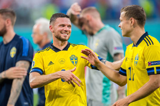 Marcus Berg and Viktor Claesson of Sweden celebrate