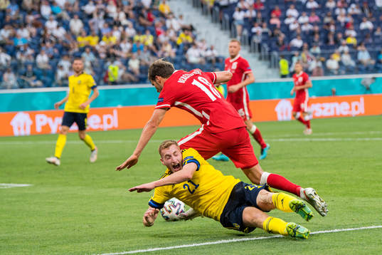 Dejan Kulusevski of Sweden and Bartosz Bereszynski of Poland