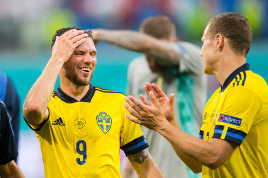 Marcus Berg and Viktor Claesson of Sweden celebrate