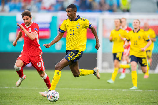 of Poland Bartosz Bereszynski and Alexander Isak of Sweden