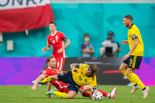 Grzegorz Krychowiak of Poland and Kristoffer Olsson of