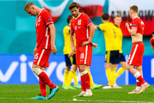 Kamil Glik and Bartosz Bereszynski of Poland looks dejected