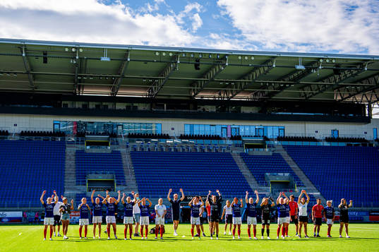 Staff and players of Vålerenga celebrate
