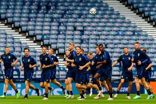 Players of the Swedish national football team warm up