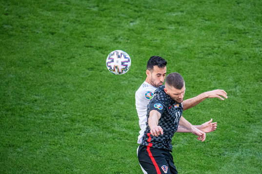 Ante Rebic of Croatia and Sergio Busquets of Spain