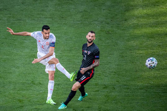 Sergio Busquets of Spain and Marcelo Brozovic of Croatia