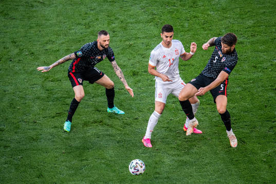 Ferran Torres of Spain and Marcelo Brozovic and Duje