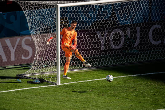 Goalkeeper Unai Simon of Spain looks dejected