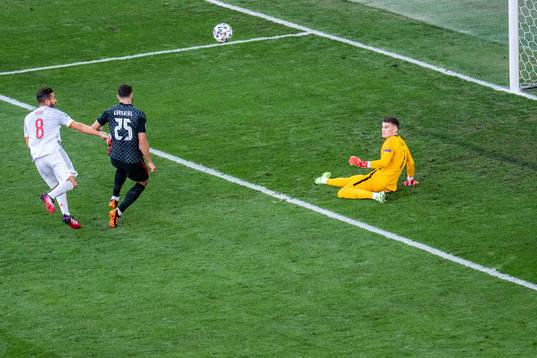 Goalkeeper Dominik Livakovic of Croatia saves a ball from