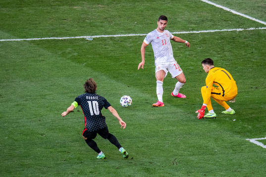 Ferran Torres of Spain and Luka Modric and goalkeeper