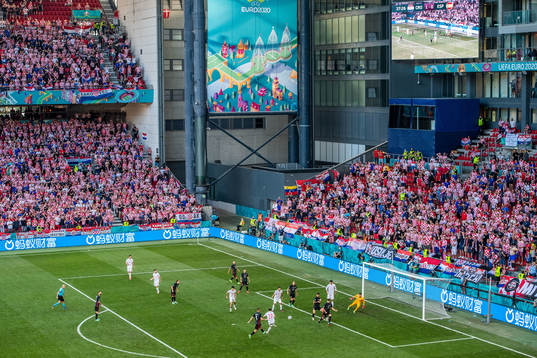 Pablo Sarabia of Spain scores 1-1 behind goalkeeper Dominik