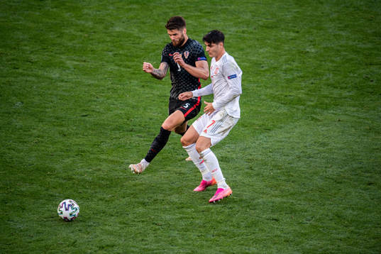 Duje Caleta-Car of Croatia and Alvaro Morata of Spain