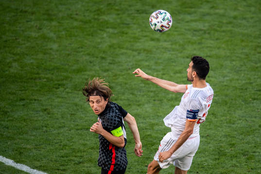 Luka Modric of Croatia and Sergio Busquets of Spain