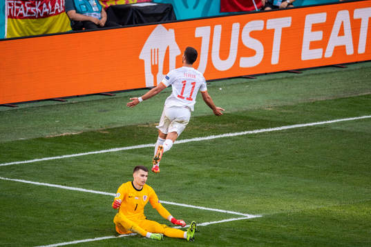 Ferran Torres of Spain celebrates and goalkeeper Dominik