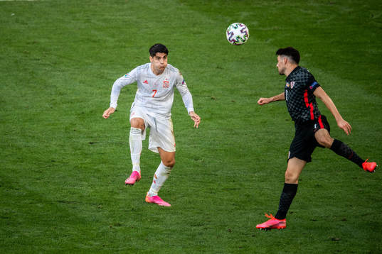 Alvaro Morata of Spain and Duje Caleta-Car of Croatia