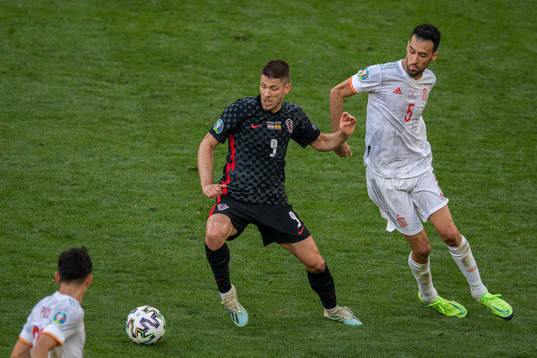 Andrej Kramaric of Croatia and Sergio Busquets of Spain