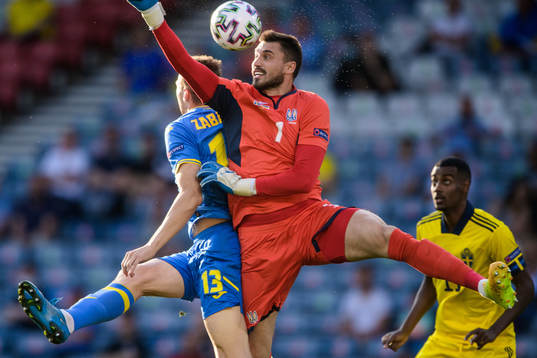 Illia Zabarnyi and goalkeeper Georgiy Bushchan of Ukraine