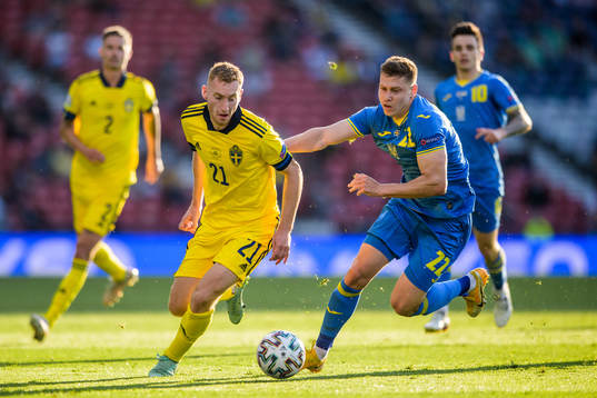 Dejan Kulusevski of Sweden and Mykola Matviyenko of Ukraine
