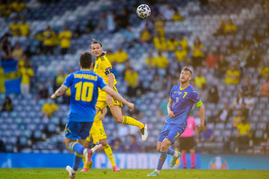 Albin Ekdal of Sweden and Andriy Yarmolenko of Ukraine
